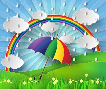 Colorful umbrella in the rain with rainbow