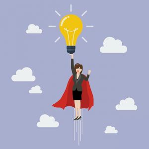 Business woman superhero holding creative lightbulb