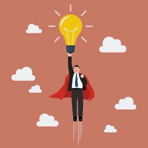 Businessman superhero holding creative lightbulb