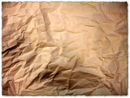 Closeup of old crumpled brown paper texture